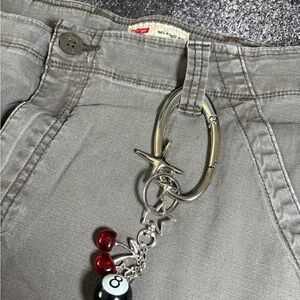 Gray Pants with Silver Keychain and Red Charms